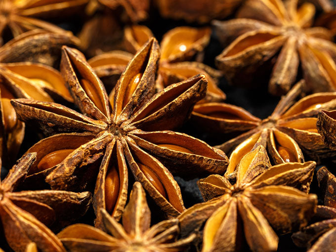Close-up of star anise seeds with a dark background