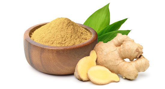 Finely dry Ginger powder in wooden bowl.